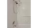 Bathroom detail showing the shower head, faucet, and white tiled walls at 1575 W Warm Springs Rd # 1111, Henderson, NV 89014