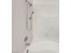 White bathtub with tile surround features a shower head and faucet at 1575 W Warm Springs Rd # 1111, Henderson, NV 89014