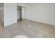 Bedroom with sliding mirror closet doors, tile floors, and ample natural light at 1575 W Warm Springs Rd # 1111, Henderson, NV 89014