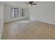 Spacious bedroom with tile flooring, ceiling fan, and large windows for natural light at 1575 W Warm Springs Rd # 1111, Henderson, NV 89014