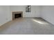 Bright living room with tile flooring, fireplace, and natural light from the window at 1575 W Warm Springs Rd # 1111, Henderson, NV 89014