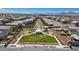 Aerial view of community park, showcasing green spaces, walking paths, and community amenities nestled between homes at 1876 Jamie Brook Pl, North Las Vegas, NV 89084