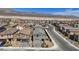 A clean neighborhood with sidewalks, landscaping and mountain views in the background at 1876 Jamie Brook Pl, North Las Vegas, NV 89084