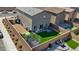 Aerial view of landscaped backyard with patio seating, lawn, trampoline and privacy fence. Great for entertaining or Gathering fun at 1876 Jamie Brook Pl, North Las Vegas, NV 89084