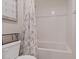 Clean, bright bathroom featuring a shower-tub combo and neutral decor at 1876 Jamie Brook Pl, North Las Vegas, NV 89084