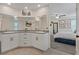 Bright Primary bathroom with granite countertop vanity and access to the main bedroom at 1876 Jamie Brook Pl, North Las Vegas, NV 89084