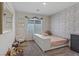 Cozy bedroom featuring a cute seat, ample natural light, and decorative wallpaper at 1876 Jamie Brook Pl, North Las Vegas, NV 89084