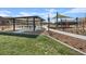 Park featuring picnic shelter and playground area, designed for Gathering fun and relaxation within the community at 1876 Jamie Brook Pl, North Las Vegas, NV 89084