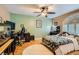 Inviting bedroom featuring a ceiling fan, a cozy bed, and a dedicated workspace at 20 High Sierra Dr, Henderson, NV 89074