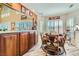 Charming breakfast nook features wood-style tile flooring and bright natural light at 20 High Sierra Dr, Henderson, NV 89074