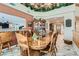 Bright dining room featuring a wooden table, decorative elements, and an open view of the living spaces at 20 High Sierra Dr, Henderson, NV 89074