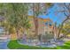 Two-story home with mature trees and manicured landscaping at 20 High Sierra Dr, Henderson, NV 89074