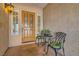 Front door with glass panes and seating area at 20 High Sierra Dr, Henderson, NV 89074