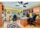 Well-lit home office featuring custom built-ins, dual desks and multiple work areas at 20 High Sierra Dr, Henderson, NV 89074