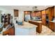 Modern kitchen with granite countertops, stainless steel appliances, and wooden cabinetry at 20 High Sierra Dr, Henderson, NV 89074