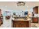 Open kitchen with granite countertops, an island cooktop, and modern stainless steel appliances at 20 High Sierra Dr, Henderson, NV 89074