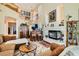 Cozy living room showcasing a fireplace, bar area, and comfortable seating for relaxing and entertaining at 20 High Sierra Dr, Henderson, NV 89074