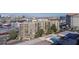 Scenic aerial view showcases the property, tennis courts, pool, and surrounding cityscape, with lush greenery at 205 E Harmon Ave # 707, Las Vegas, NV 89169