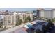 Aerial view of the building with tennis courts, swimming pool, and cityscape views at 205 E Harmon Ave # 707, Las Vegas, NV 89169