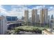 Enjoy beautiful views of Las Vegas from this condo building with a lush golf course and mature trees at 205 E Harmon Ave # 707, Las Vegas, NV 89169