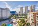 Enjoy beautiful views of Las Vegas from this condo building with a lush pool, palm trees and more at 205 E Harmon Ave # 707, Las Vegas, NV 89169