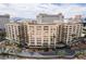 Exterior view of the building with ample balconies, lush greenery, and well-maintained grounds at 205 E Harmon Ave # 707, Las Vegas, NV 89169