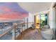 Relaxing balcony with a view of the city skyline, seating and sliding door to the bedroom at 222 Karen Ave # 3908, Las Vegas, NV 89109