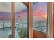 Relax on the private balcony with city views during a beautiful pink sunset at 222 Karen Ave # 3908, Las Vegas, NV 89109