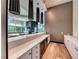 Modern bar area featuring sleek countertops, wine storage, and stylish pendant lighting fixtures at 222 Karen Ave # 3908, Las Vegas, NV 89109