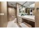 This bathroom features a tile accent wall, toilet, vanity area, and storage at 222 Karen Ave # 3908, Las Vegas, NV 89109