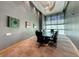 Modern conference room with a glass table, ergonomic chairs, and contemporary artwork for a professional setting at 222 Karen Ave # 3908, Las Vegas, NV 89109