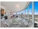 Elegant dining space with glass table and city views, adjacent to the living area at 222 Karen Ave # 3908, Las Vegas, NV 89109