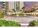 Circular driveway leading to the tower entrance, enhanced by well-maintained greenery and palm trees at 222 Karen Ave # 3908, Las Vegas, NV 89109