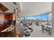 Open floor plan of gourmet kitchen and living room with expansive city views at 222 Karen Ave # 3908, Las Vegas, NV 89109