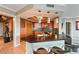 Modern kitchen with wood cabinets, stainless steel appliances and a black countertop with seating at 222 Karen Ave # 3908, Las Vegas, NV 89109