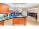 Gourmet kitchen with wood cabinetry, stainless appliances, and a stunning city view at 222 Karen Ave # 3908, Las Vegas, NV 89109