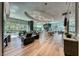 Spacious lounge area featuring hardwood floors, comfortable seating, and elegant lighting fixtures at 222 Karen Ave # 3908, Las Vegas, NV 89109
