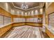 Interior mailroom with honey colored wood paneling and decorative lighting fixture at 222 Karen Ave # 3908, Las Vegas, NV 89109