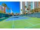 Exterior shot of a well-maintained tennis court with tall buildings behind at 222 Karen Ave # 3908, Las Vegas, NV 89109