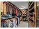A spacious walk-in closet with shelves and hanging space for organized clothing and accessories at 222 Karen Ave # 3908, Las Vegas, NV 89109