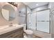 Neutral bathroom featuring a vanity with modern sink, toilet, and shower over tub at 2836 Floral Peak Dr, Henderson, NV 89074