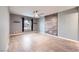 Spacious bedroom with plank flooring, a ceiling fan, and an accent wall at 2836 Floral Peak Dr, Henderson, NV 89074