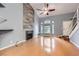 Bright living room featuring hardwood floors, a fireplace, and ample natural light at 2836 Floral Peak Dr, Henderson, NV 89074
