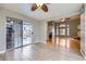 Connected dining and living spaces with sliding door access to outdoor area at 2836 Floral Peak Dr, Henderson, NV 89074