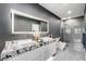 Contemporary bathroom featuring a dual sink vanity, sleek toilet, and a spacious glass shower at 2861 Queens Courtyard Dr, Las Vegas, NV 89109