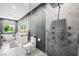 Modern bathroom features a luxury shower, soaking tub, and granite vanity with dual sinks at 2861 Queens Courtyard Dr, Las Vegas, NV 89109