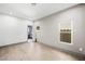 Empty bedroom with hardwood floors and large windows allowing for natural light at 2861 Queens Courtyard Dr, Las Vegas, NV 89109