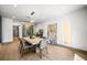 Elegant dining room showcasing modern lighting, neutral paint colors, and hardwood floors at 2861 Queens Courtyard Dr, Las Vegas, NV 89109