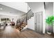 Bright entryway features wood floors, iron railing staircase, and a modern aesthetic at 2861 Queens Courtyard Dr, Las Vegas, NV 89109