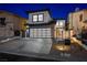 Stunning two-story home with a modern garage door and well-maintained landscaping at 2861 Queens Courtyard Dr, Las Vegas, NV 89109